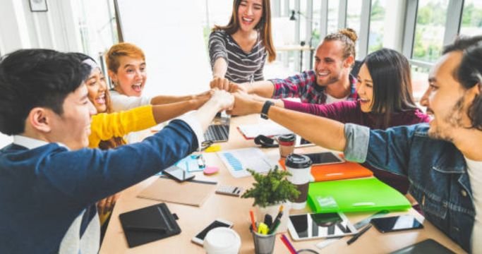 Student leading a community volunteer project with a group outdoors.