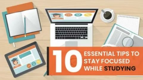 A colorful, overhead flat-lay image showing a student's desk setup with a prominent orange banner that reads: "10 ESSENTIAL TIPS TO STAY FOCUSED WHILE STUDYING." The desk surface contains various study items, including: A laptop open to a screen showing an educational interface. An open notebook with a pencil. A tablet displaying a similar educational interface. A cup of coffee and a small white notebook. A textbook or binder with a magnifying glass resting on it.