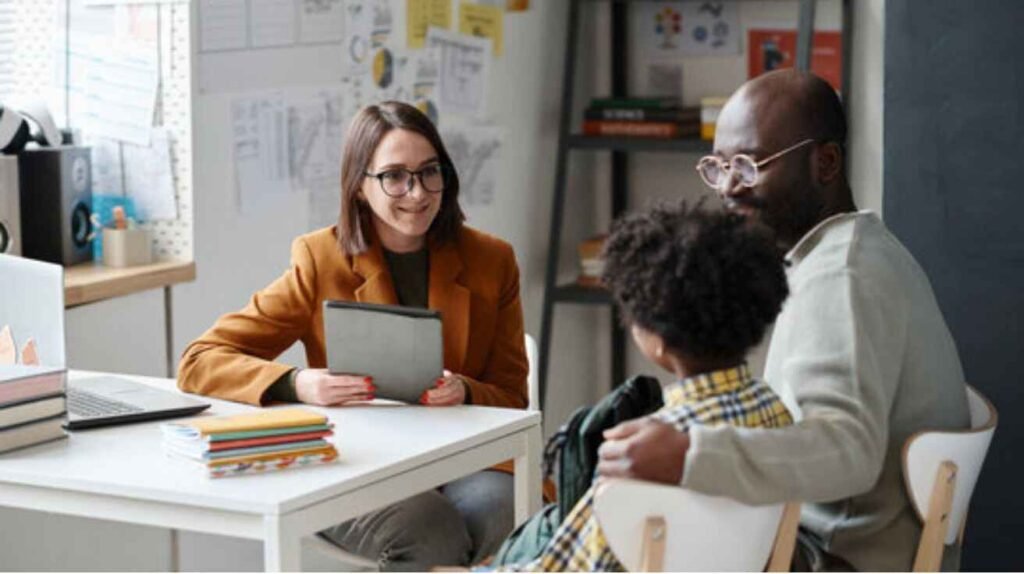 Parents and teachers collaborating to support a student’s progress in special education.